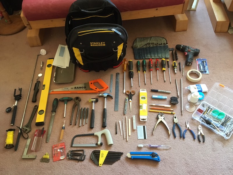 Tool backpack contents arrayed neatly